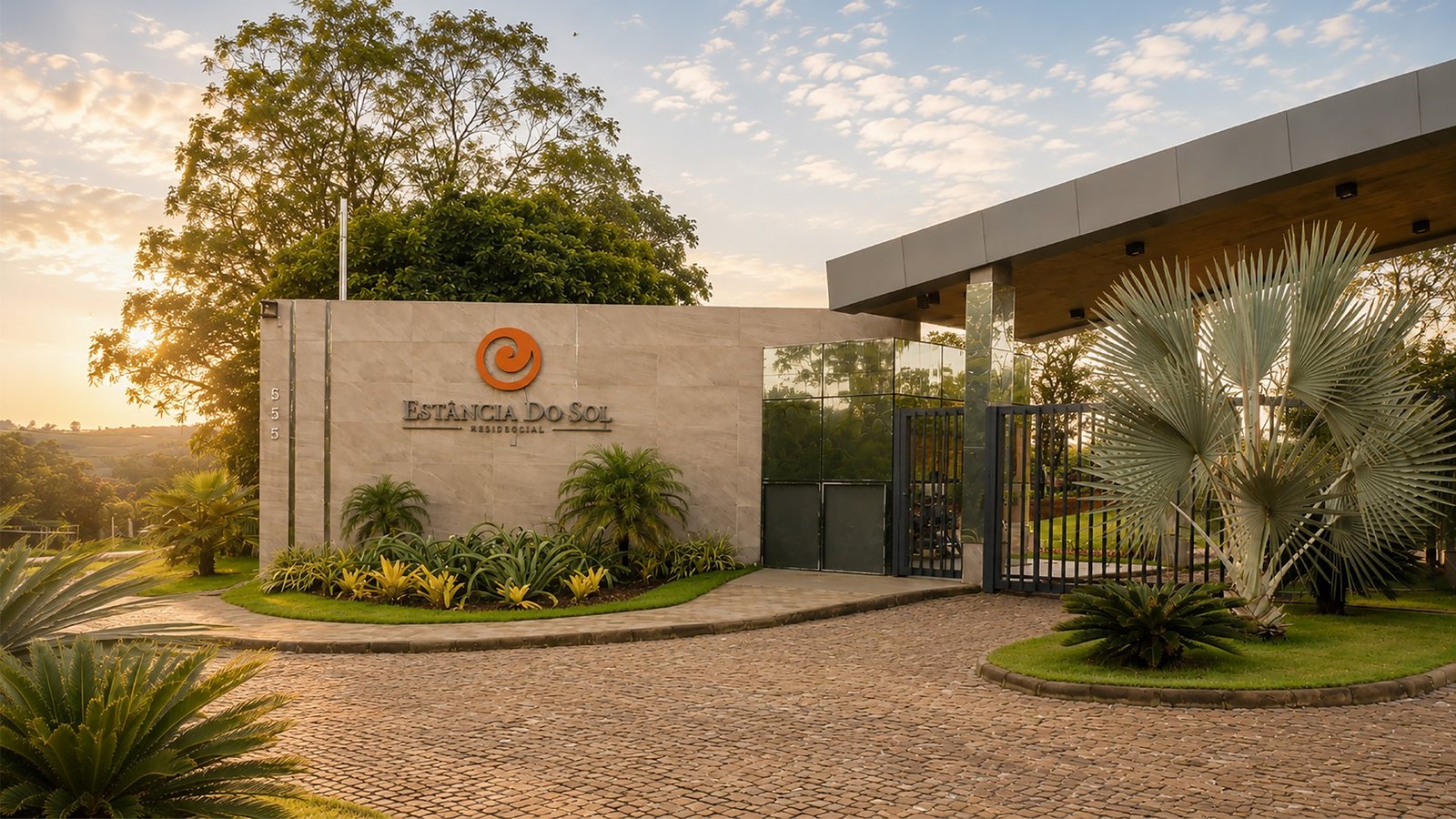 Portaria do Estância do Sol com jardim e acesso controlado